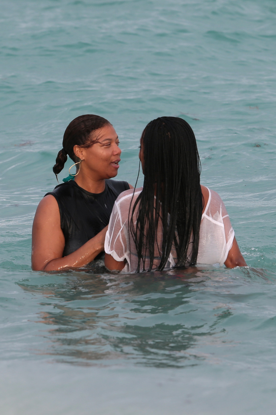 Queen Latifah enjoys a day at the beach with her friends in Miami